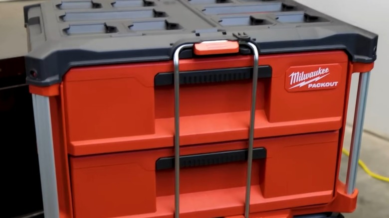 A Milwaukee Packout container on a concrete floor