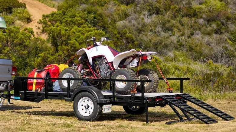 ATV and gas cans on Harbor Freight 5x10 utility trailer.