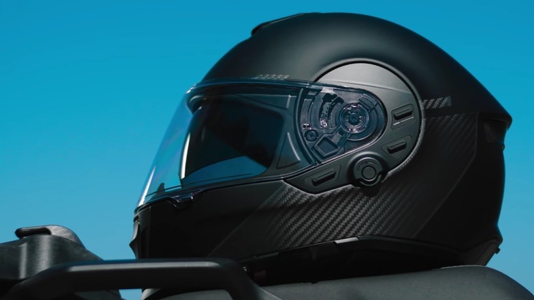 Close up view of a Cardo helmet from the side.