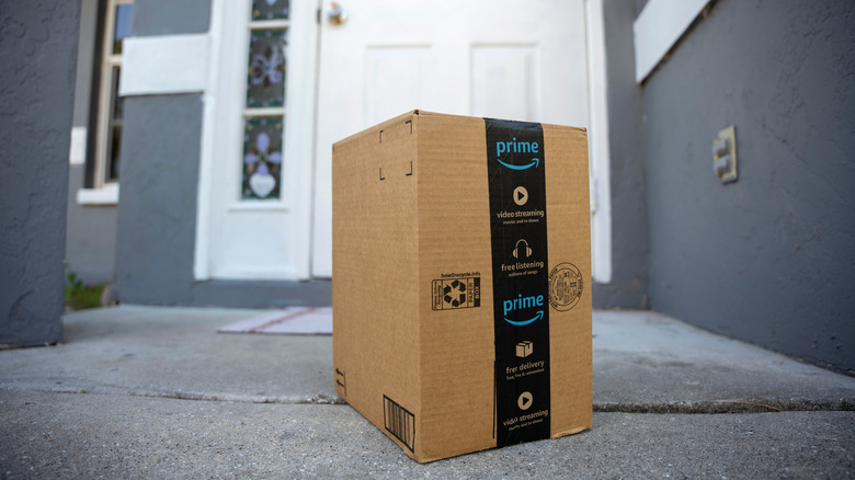 An Amazon Prime package on a front doorstep.