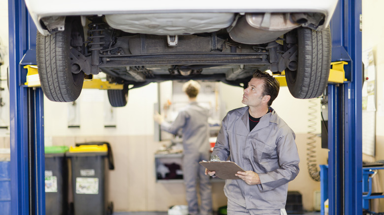 mechanic inspecting a car
