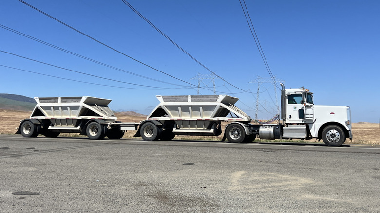 semi truck with a double trailer on the road