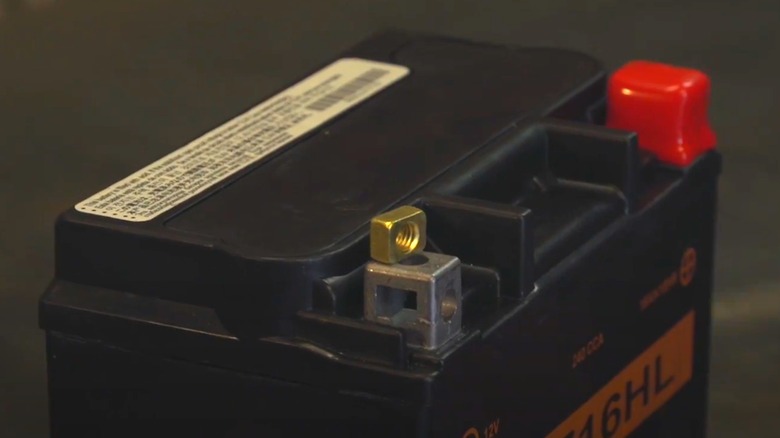 A motorcycle battery on a table.