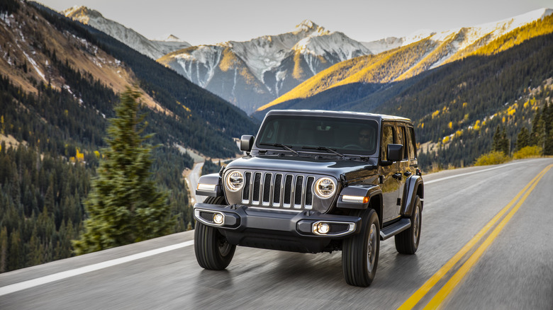 Front shot of a 2019 Jeep Wrangler Sahara on a mountain road