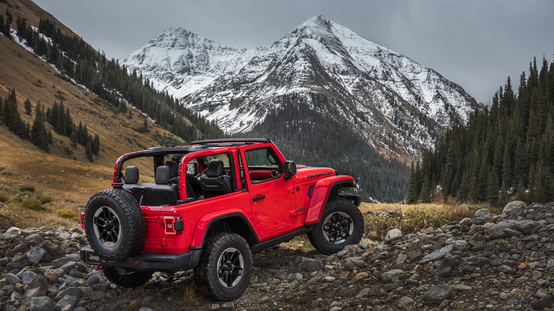 Rear-quarter shot of a 2019 Jeep Wrangler Rubicon off-roading