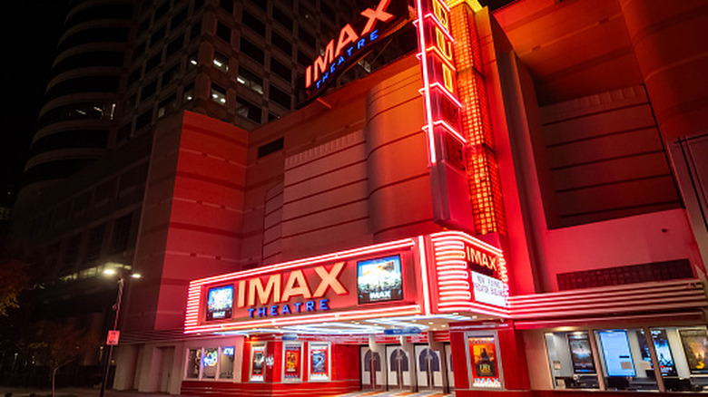 Illuminated cinema building at night