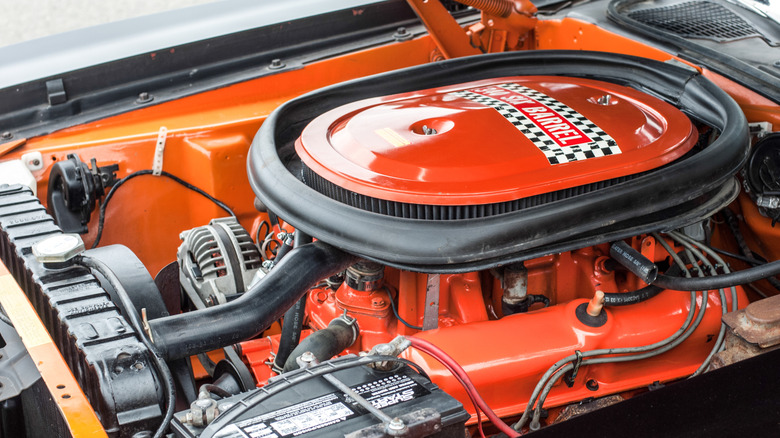 Underhood view of orange 1970 AAR 'Cuda showing engine