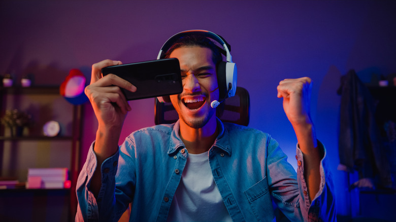 Man gaming on smartphone