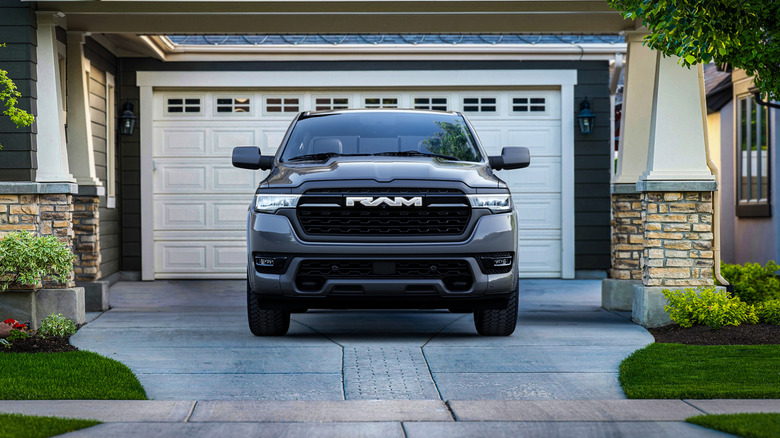 2026 RAM 1500 parked in front of suburban home, front-view