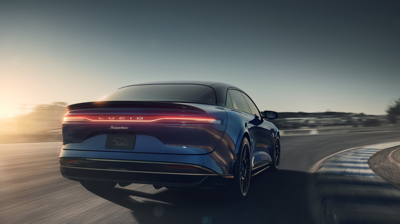2023 Lucid Air at Willow Springs, rear-view, turning right at speed