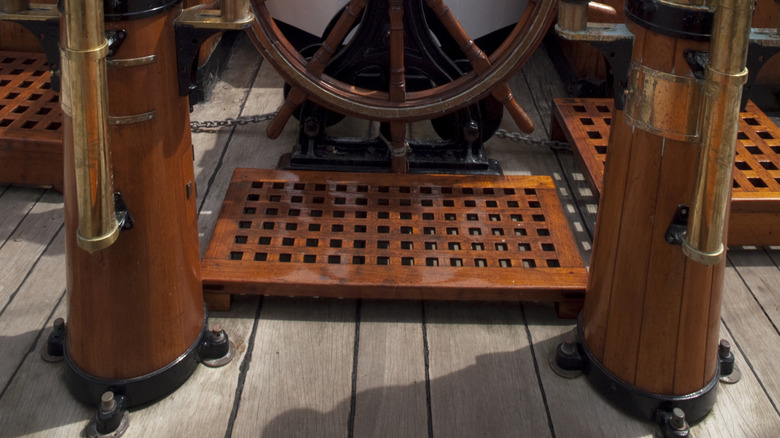 Old ship's wheel and binnacles