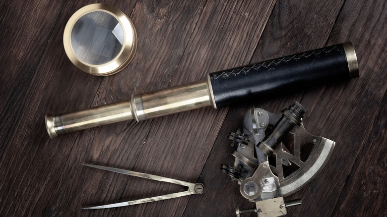 Navigational tools on wooden surface