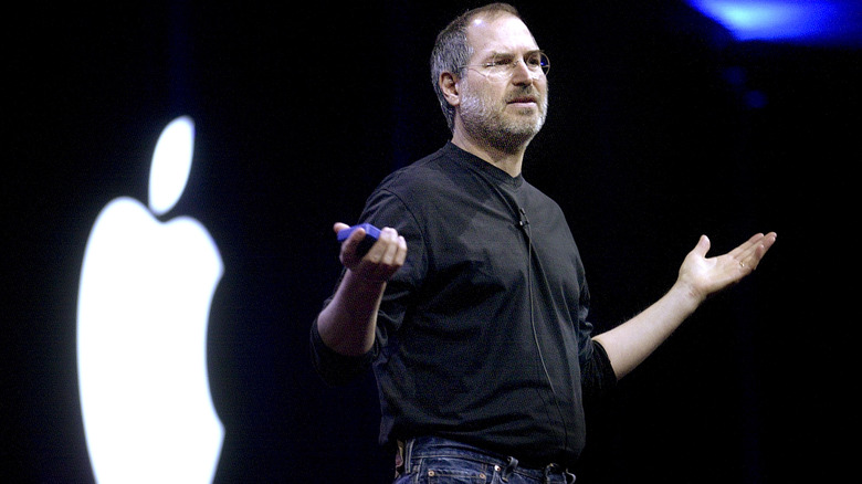 Steve Jobs with Apple logo in background