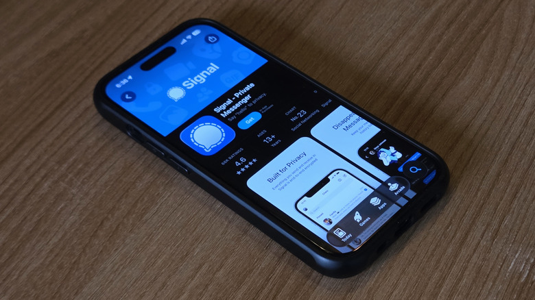 An iPhone 15 displays the App Store page for Signal