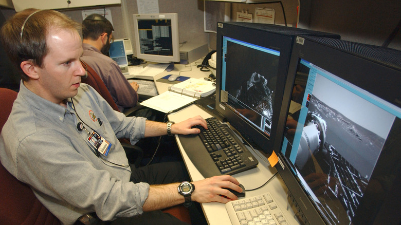 Man reviewing mars rover images
