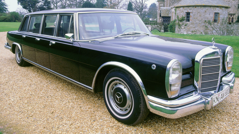 A black six-door Mercedes-Benz 600.