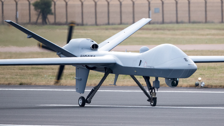 An MQ-9B SkyGuardian on a runway about to take off.