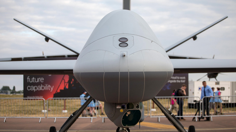 A front view of the MQ-9B SkyGuardian sitting on a runway.