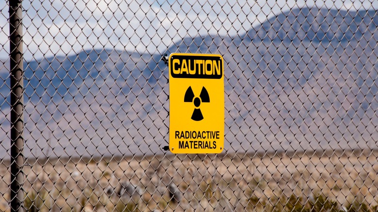 Radioactive materials sign on a fence in New Mexico desert