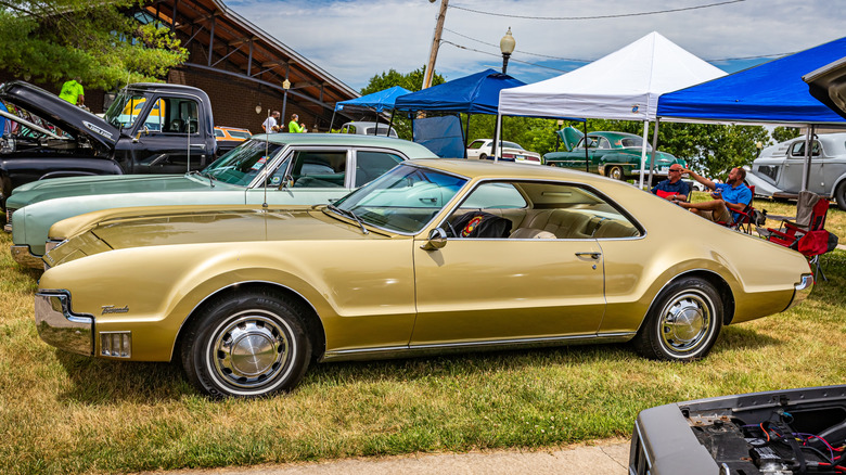 Gold 1967 Oldsmobile Toronado at car show