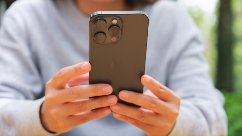 person typing on phone