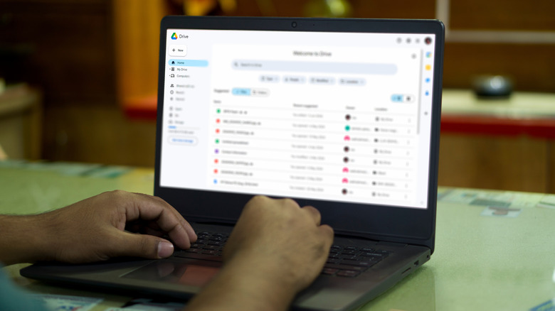 Man using Google Drive on a black laptop