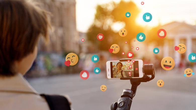 Person vlogging with many likes