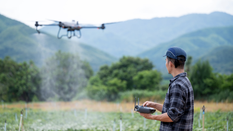 A person flying a drone outside.