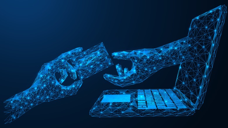 hand projecting from a laptop screen taking a card