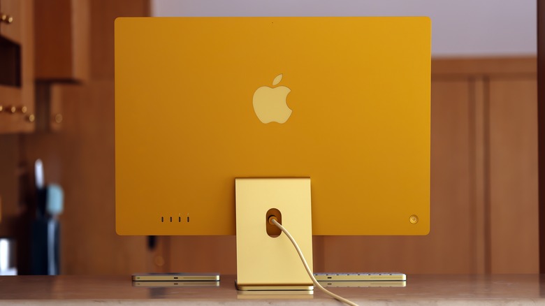 yellow 24-inch iMac on countertop