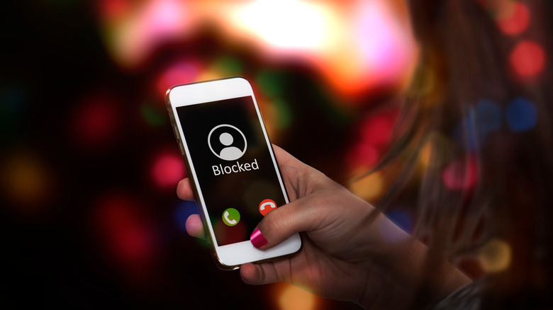 Woman blocking phone number