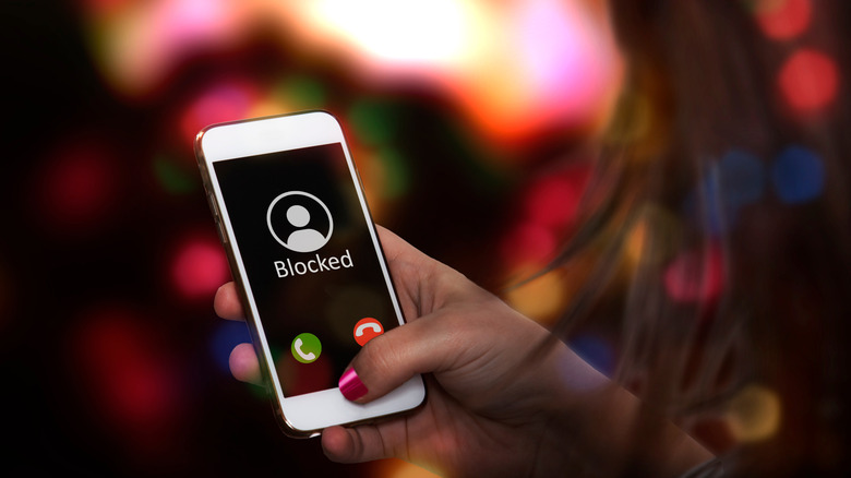 Woman blocking phone number