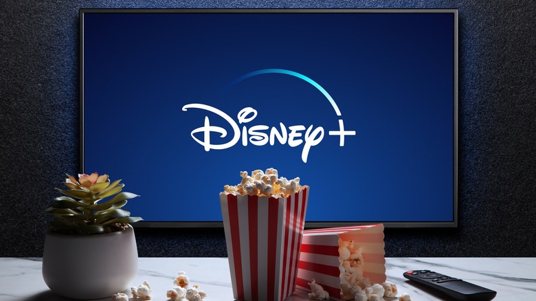 disney plus on tv with popcorn