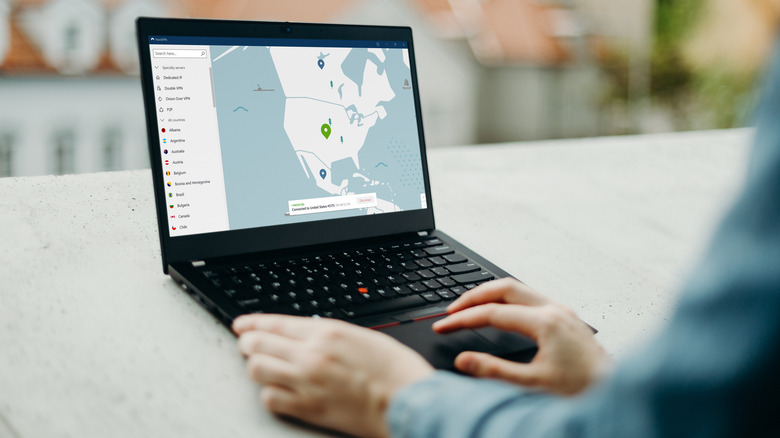 Person using NordVPN on laptop