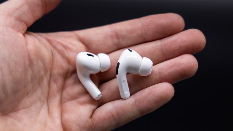 Apple airpods in hand
