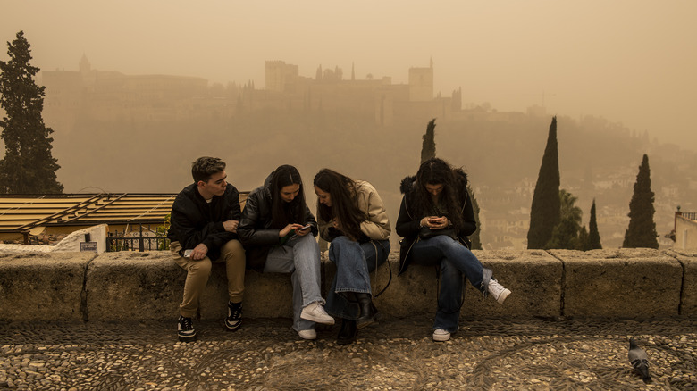 young people looking at smartphones