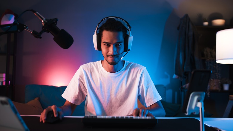 young man games on PC