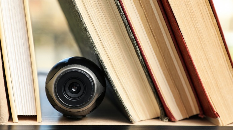 hidden camera between books on shelf