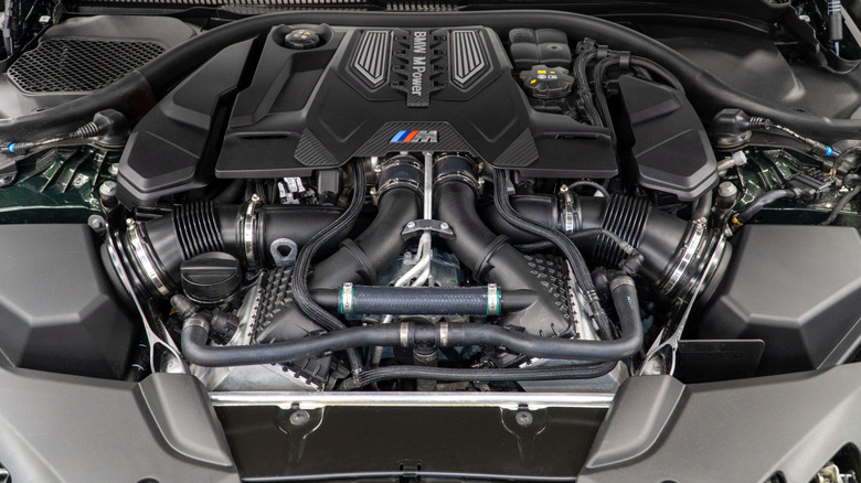 A close up of a BMW M division engine under the hood.