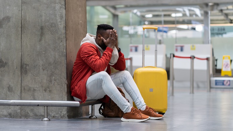 Distressed traveler waiting for flight