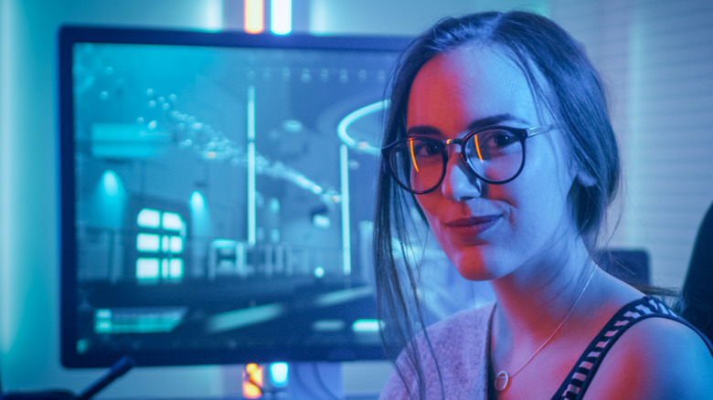 Woman in front of gaming monitor