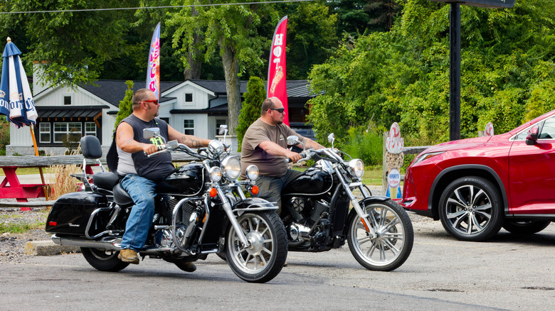 Two bikers riding Harley-Davidson bikes