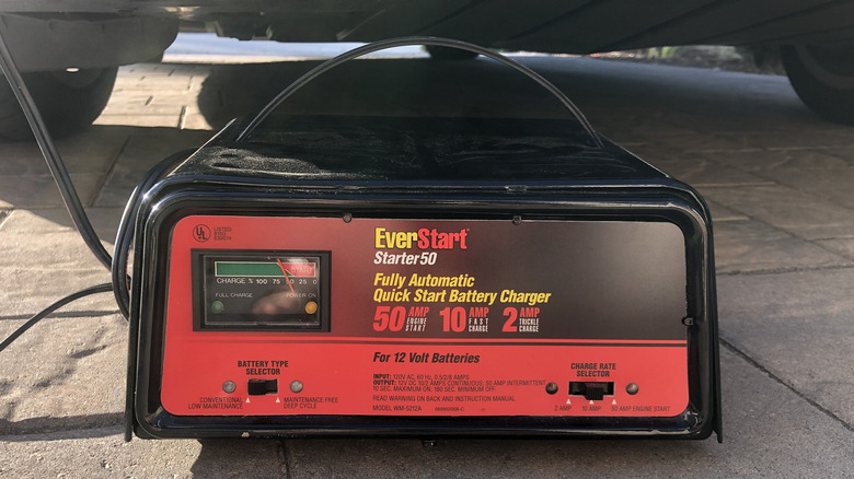 Automatic car battery charger underneath a car