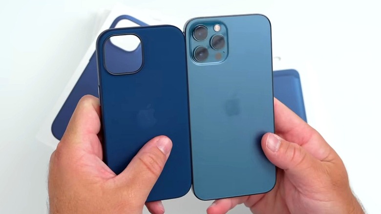 iPhone next to blue FineWoven case