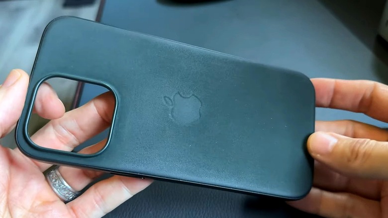 Person holding FineWoven case