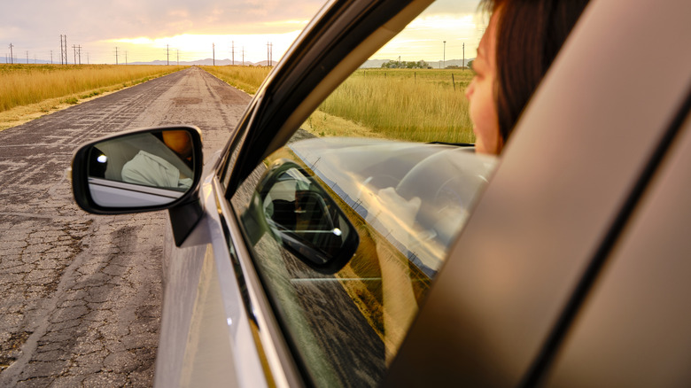 People in a car looking out of window