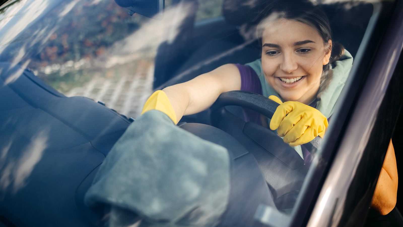 How To Clean The Film From Your Car's Windshield (And Keep It Off)