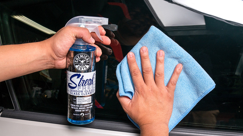 Cleaning tinted car window using cleaner