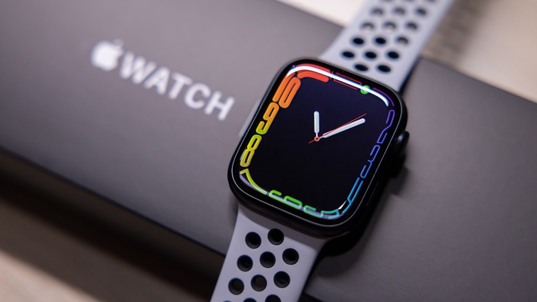 Apple Watch on its box with a gray band