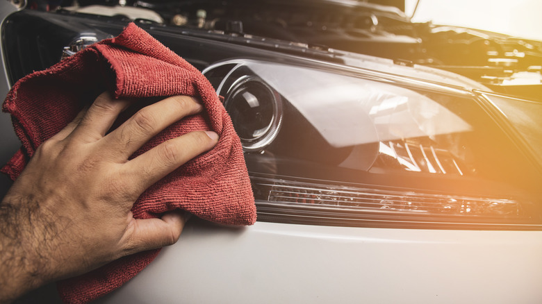 Hand cleaning car headlight